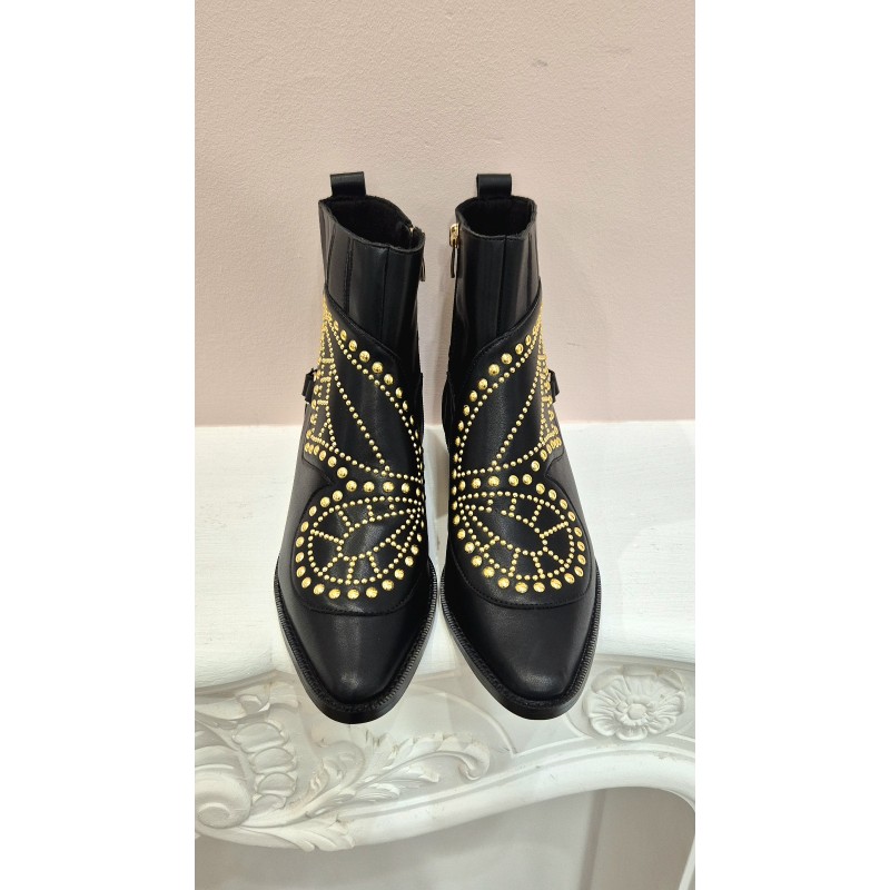BOTÍN PIEL NEGRO MARIPOSA Y TACHAS